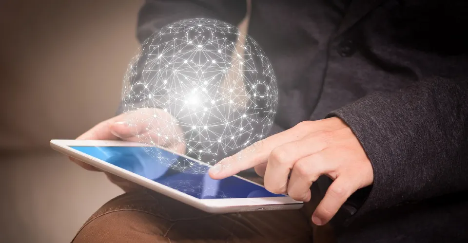 Man using a tablet with a connected globe overlay